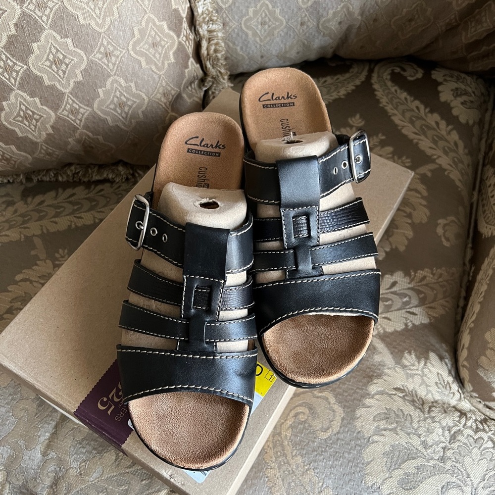 Black Clark’s sandals in size 10.